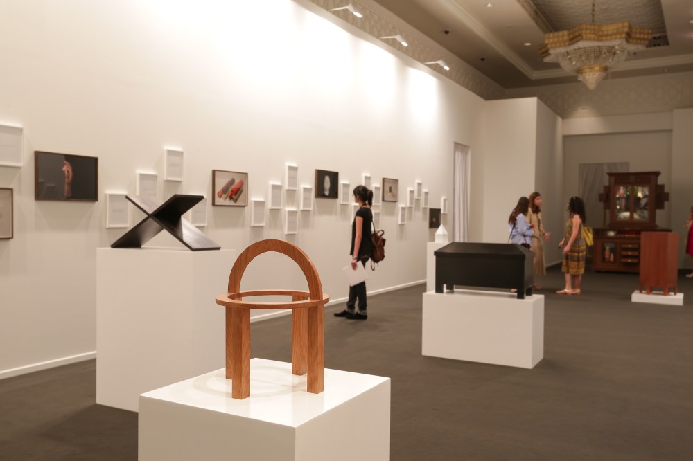 Iman Issa 'Common Elements' Medium : Fifty-five text panels, fourteen framed C-prints, and five wooden sculptures on white plinths. Courtesy : Abraaj Group Art Prize 2013.