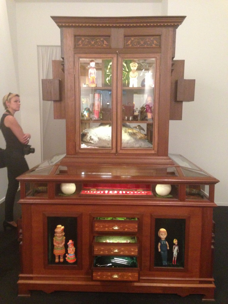 Huma Mulji 'The Miraculous Lives of This and That' Medium : Wooden cabinet, various objects including taxidermy animals, plastic toys and dust. Courtesy: Al Mahha Art Blog